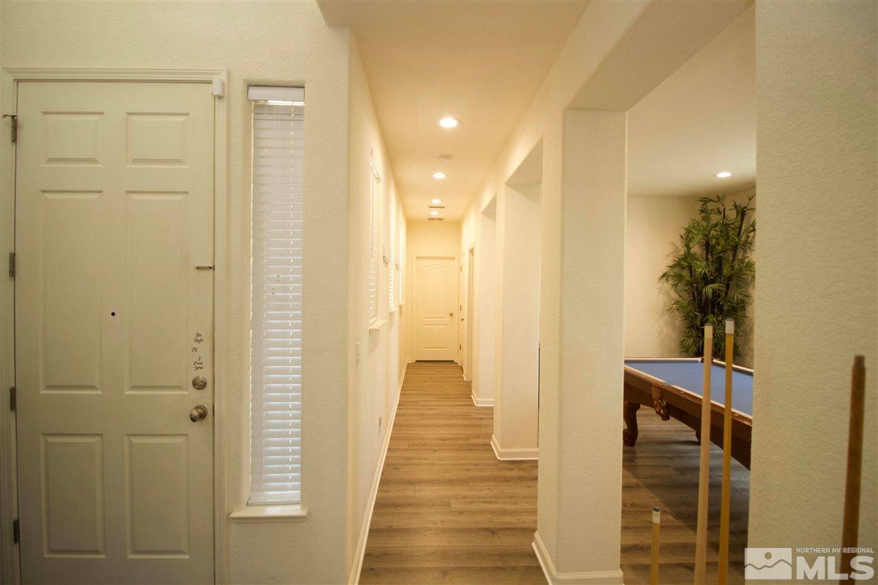 505 Terracina Way Reno, NV 89521 - Photo 6 of 26 a view of hallway with wooden floor
