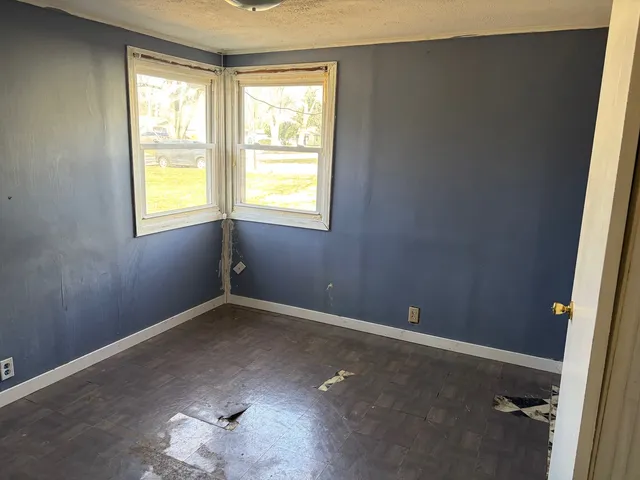 an empty room with windows