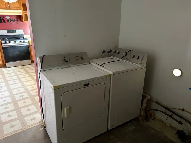 a utility room with dryer and washer