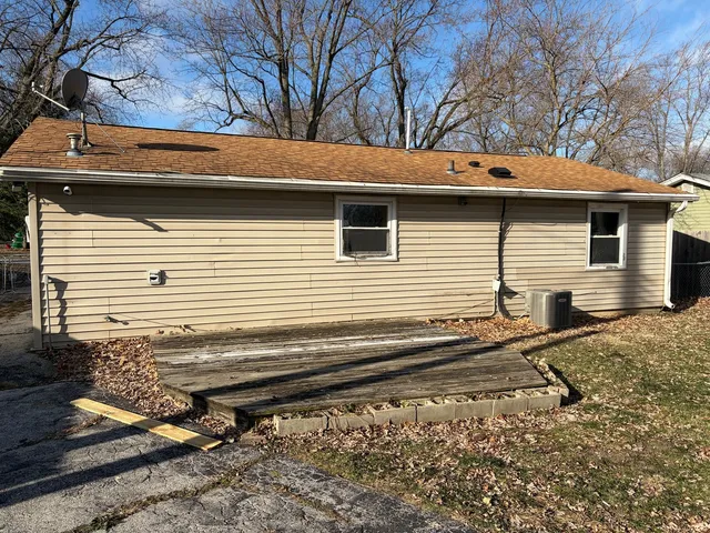a view of a backyard with a large tree