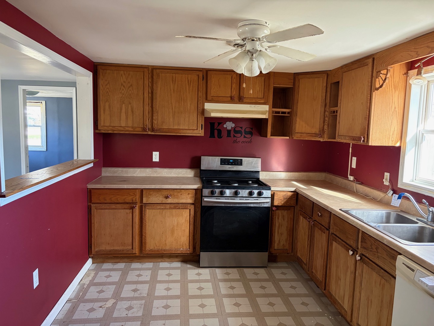 3543 William Street Steger, IL 60475 - Photo 8 of 21 a kitchen with stainless steel appliances granite countertop a stove a sink and a microwave