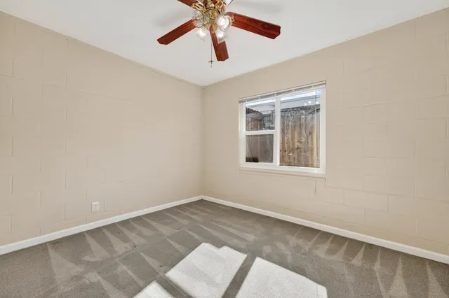 an empty room with cabinet area