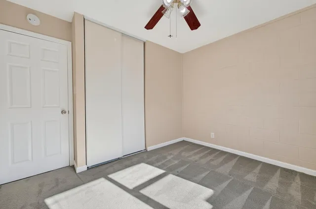 a view of an empty room with a window