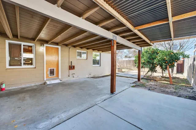 a view of backyard with porch