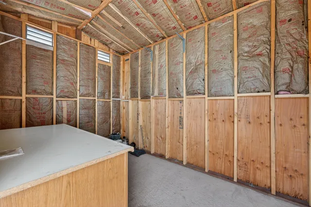 a view of a backyard with sitting area