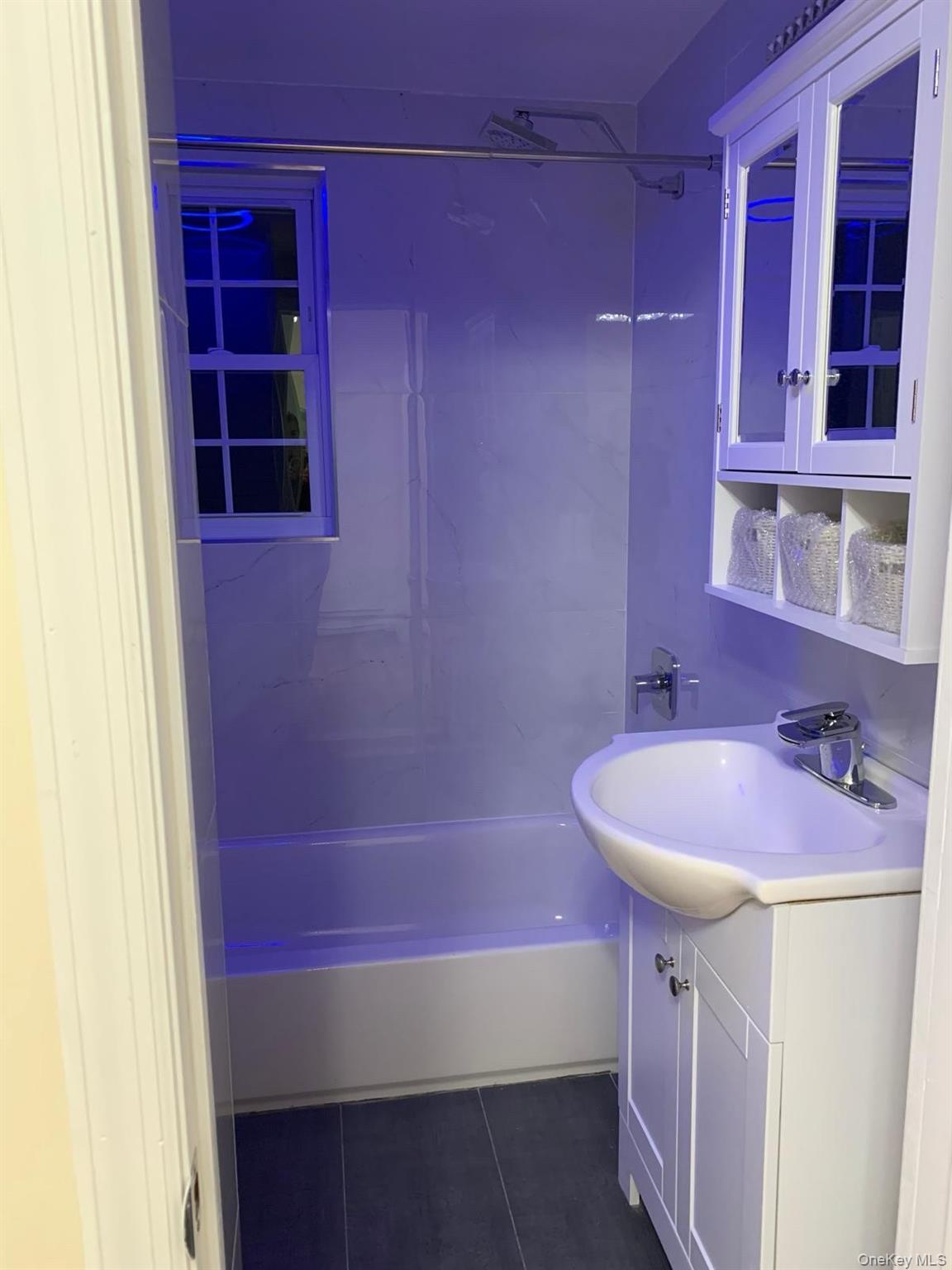 39 Ann Street Ossining, NY 10562 - Photo 16 of 27 a bathroom with a sink a bath tub and a shower