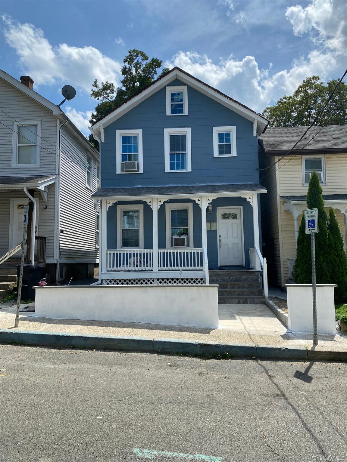 39 Ann Street Ossining, NY 10562 - Photo 2 of 27 a front view of a house with garage