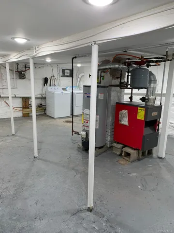 a view of a backyard with potted plants and large tree