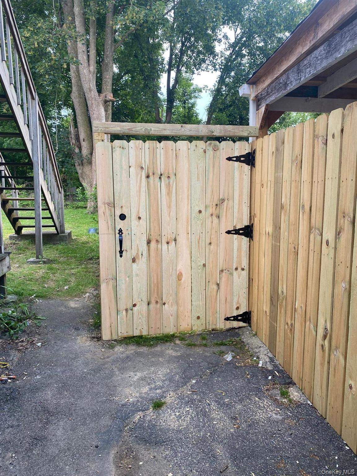 39 Ann Street Ossining, NY 10562 - Photo 27 of 27 a view of a backyard with potted plants and large tree