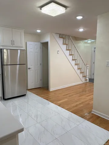 a view of a hallway with an empty room