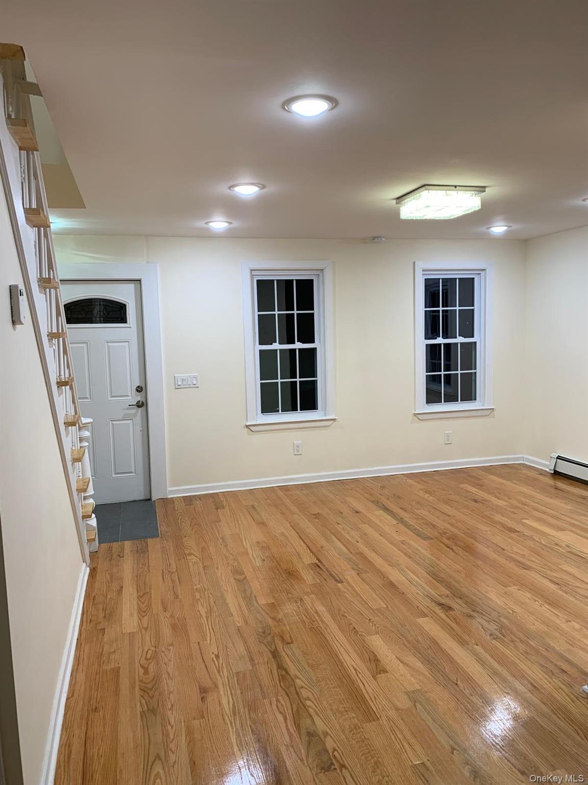 39 Ann Street Ossining, NY 10562 - Photo 7 of 27 a view of an empty room with wooden floor and a window