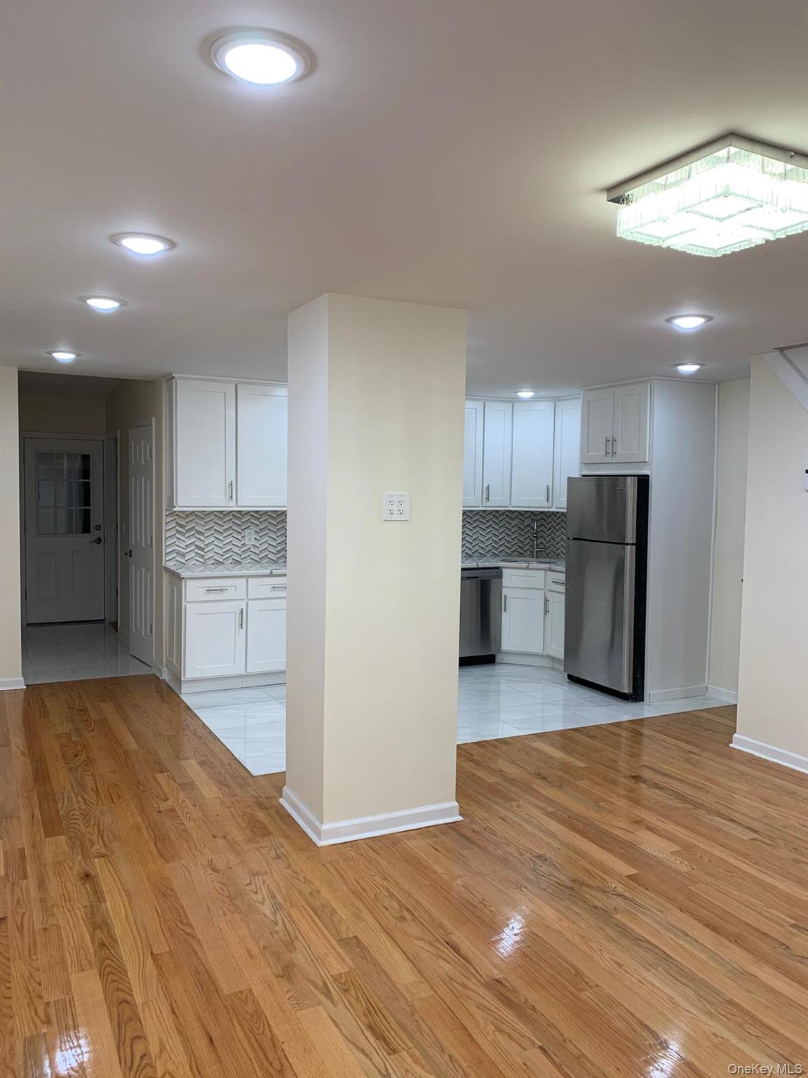 39 Ann Street Ossining, NY 10562 - Photo 10 of 27 a view of a kitchen with a sink and a refrigerator