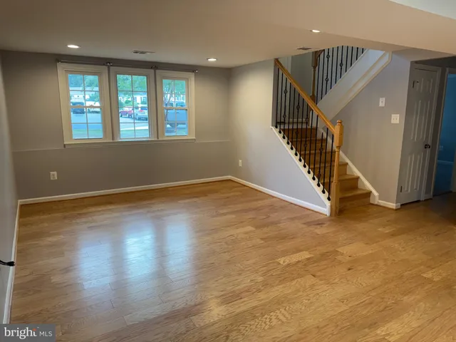 a view of an entryway with wooden floor