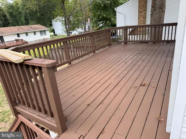 a view of balcony with wooden floor