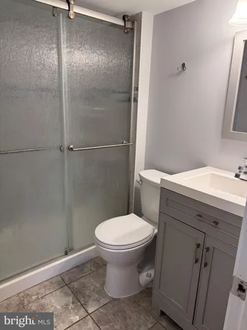 a bathroom with a toilet and a sink