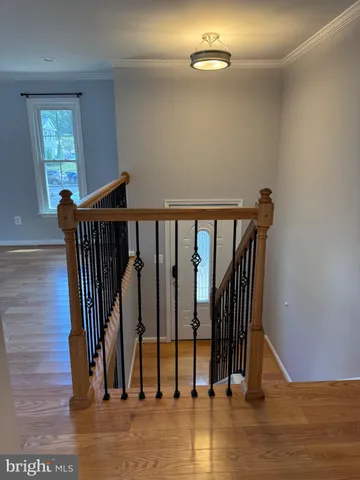 a view of entryway with wooden floor