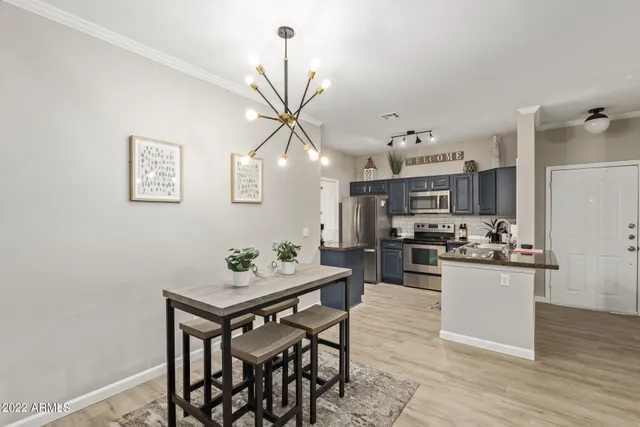 a kitchen with a table and chairs in it