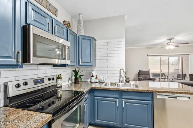 a kitchen with a stove and a sink