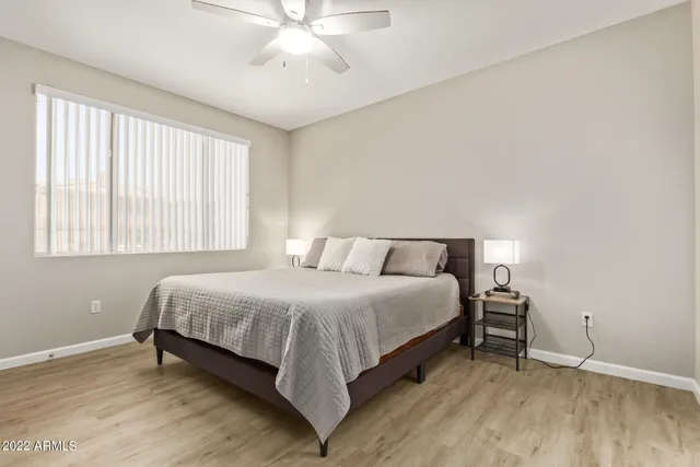 a bedroom with a bed and window