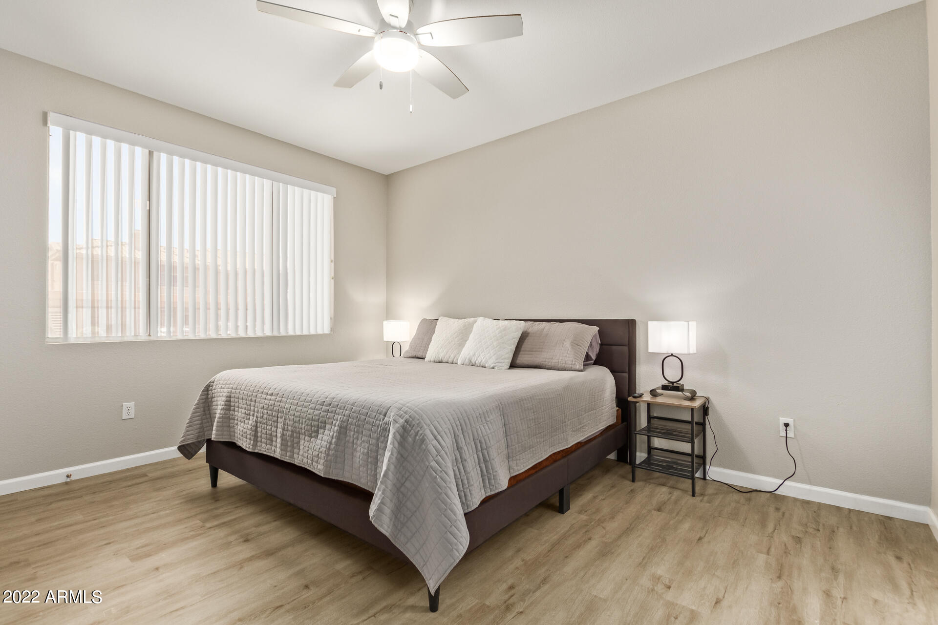 16013 South Desert Foothills Parkway, Unit 1033 Phoenix, AZ 85048 - Photo 15 of 42 a bedroom with a bed and window