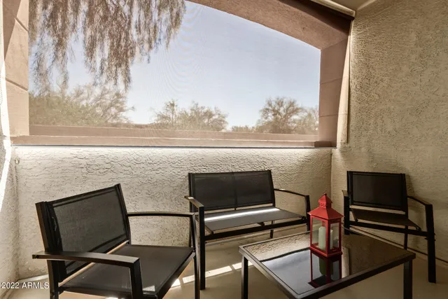 a view of a livingroom with furniture and a flat screen tv