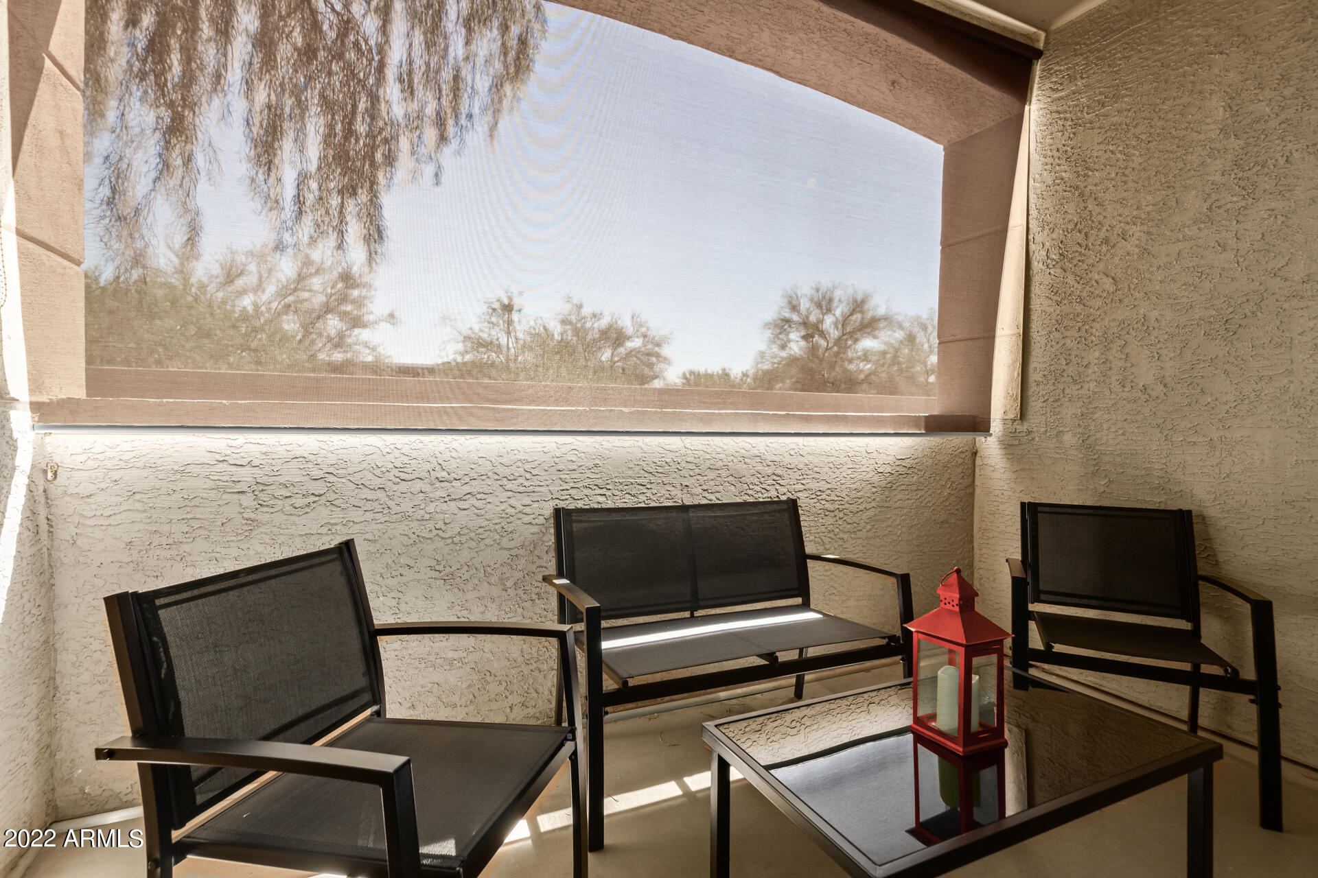 16013 South Desert Foothills Parkway, Unit 1033 Phoenix, AZ 85048 - Photo 26 of 42 a view of a livingroom with furniture and a flat screen tv