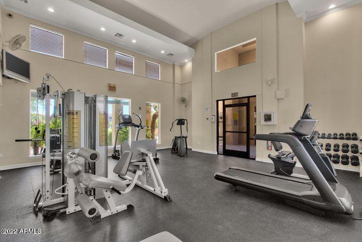 16013 South Desert Foothills Parkway, Unit 1033 Phoenix, AZ 85048 - Photo 28 of 42 a view of a room with gym equipment
