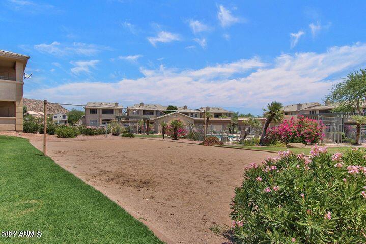 16013 South Desert Foothills Parkway, Unit 1033 Phoenix, AZ 85048 - Photo 30 of 42 a view of a lake with a building in the background