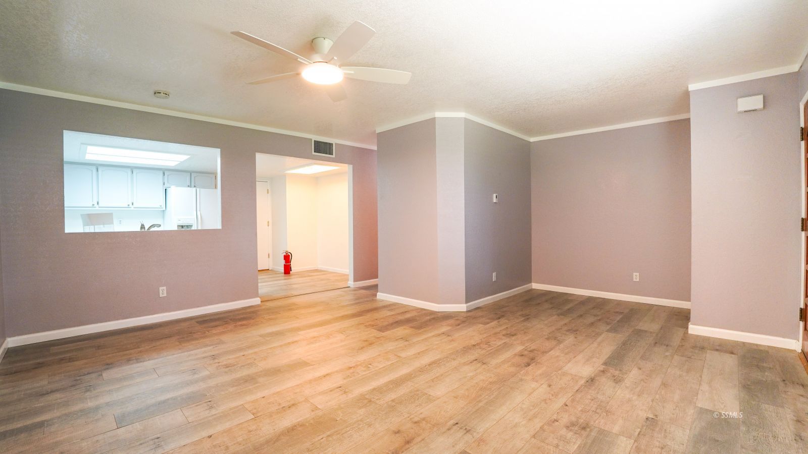 293 East Upjohn Avenue Ridgecrest, CA 93555 - Photo 3 of 21 wooden floor in an empty room