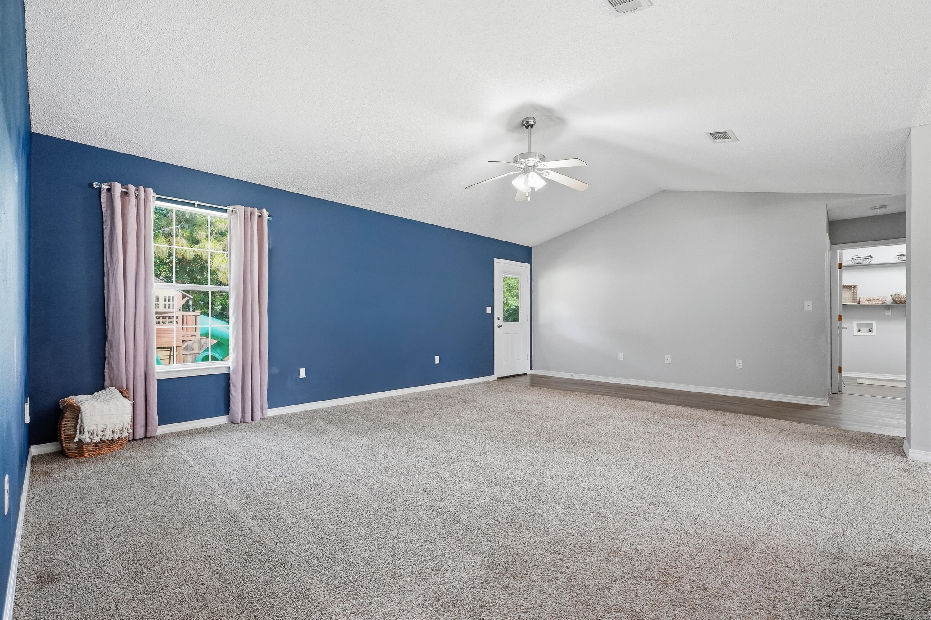 3033 Cabela Lane Crestview, FL 32539 - Photo 4 of 32 a view of an empty room with a window