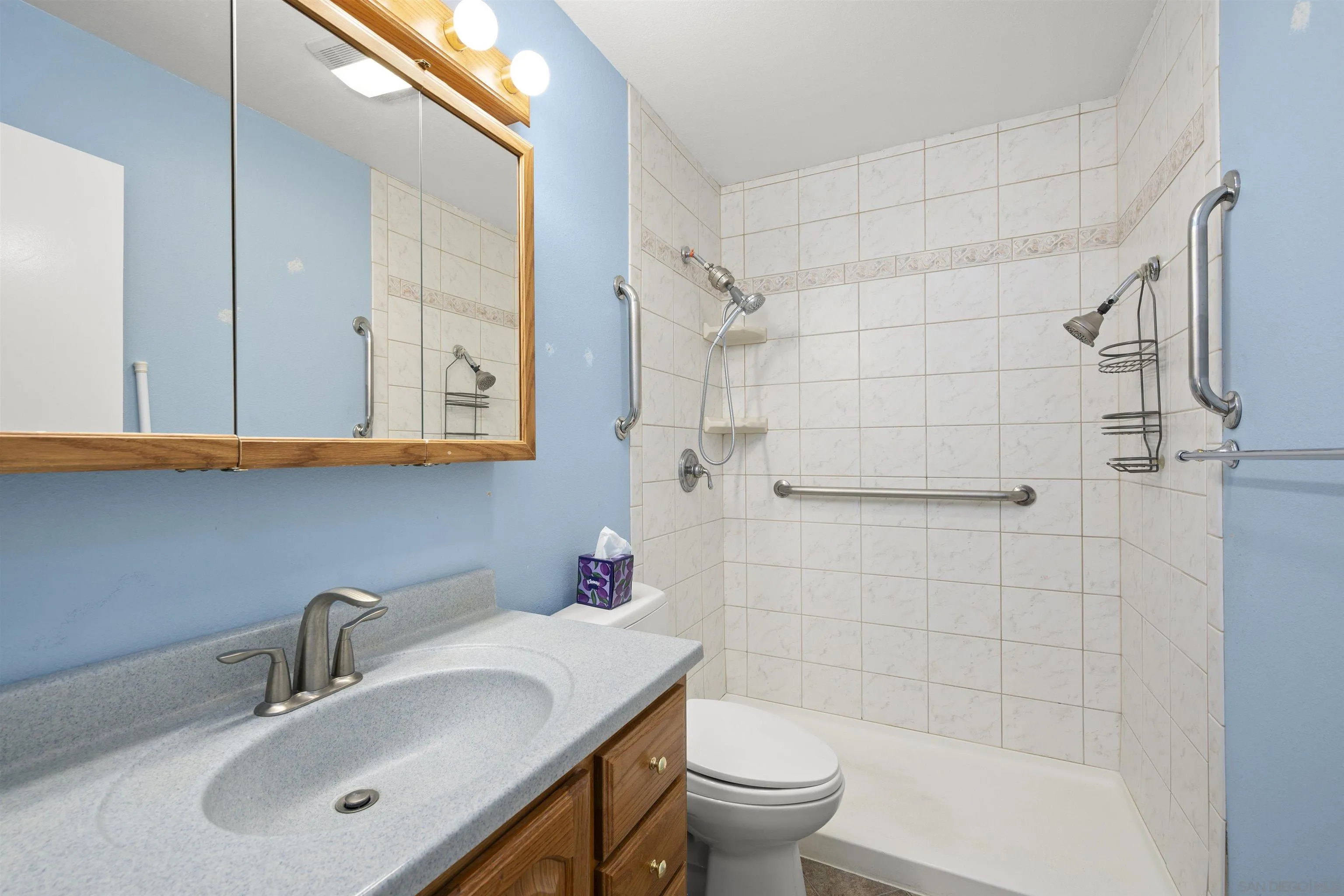12679 Ridgeton Drive Lakeside, CA 92040 - Photo 19 of 33 a bathroom with a sink a toilet and shower
