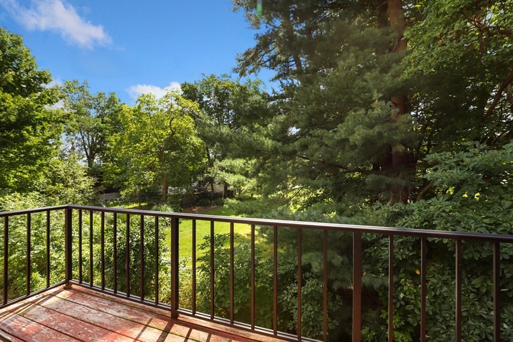 47 West Street, Unit C4 Randolph, MA 02368 - Photo 15 of 19 a view of a balcony with wooden floor
