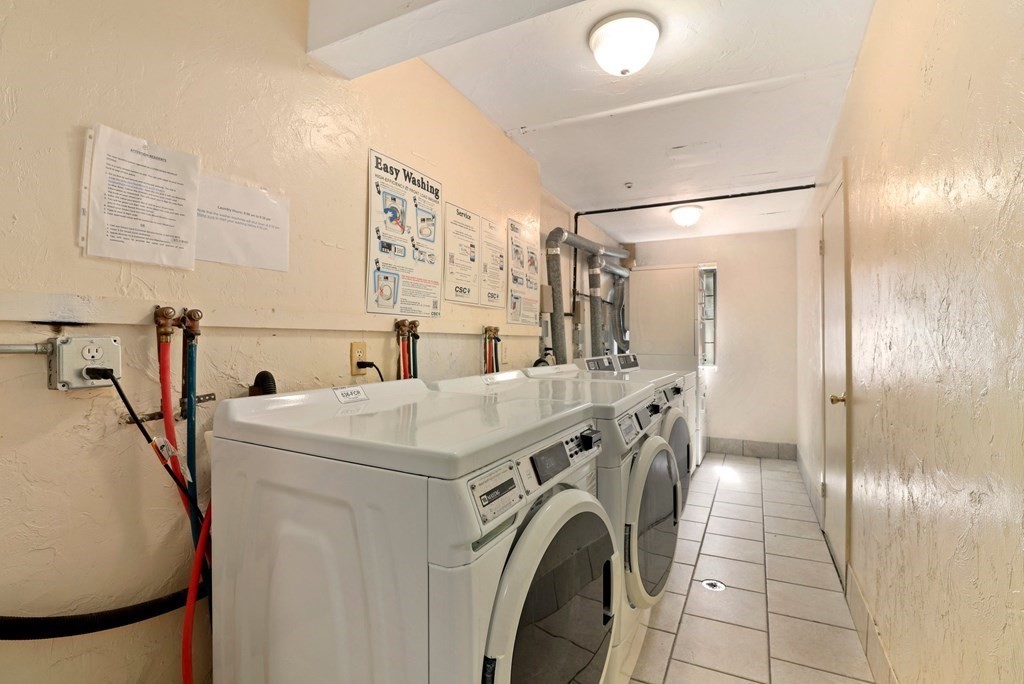 47 West Street, Unit C4 Randolph, MA 02368 - Photo 16 of 19 a utility room with dryer and washer