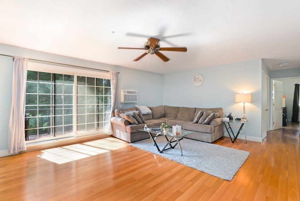 47 West Street, Unit C4 Randolph, MA 02368 - Photo 3 of 19 a living room with furniture and a window