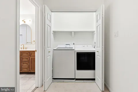 a bathroom with a shower and a sink
