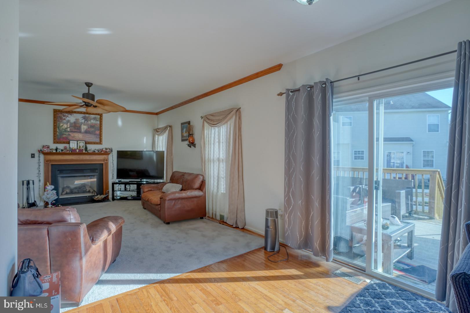 226 York Drive Smyrna, DE 19977 - Photo 16 of 60 a living room with furniture and a fireplace