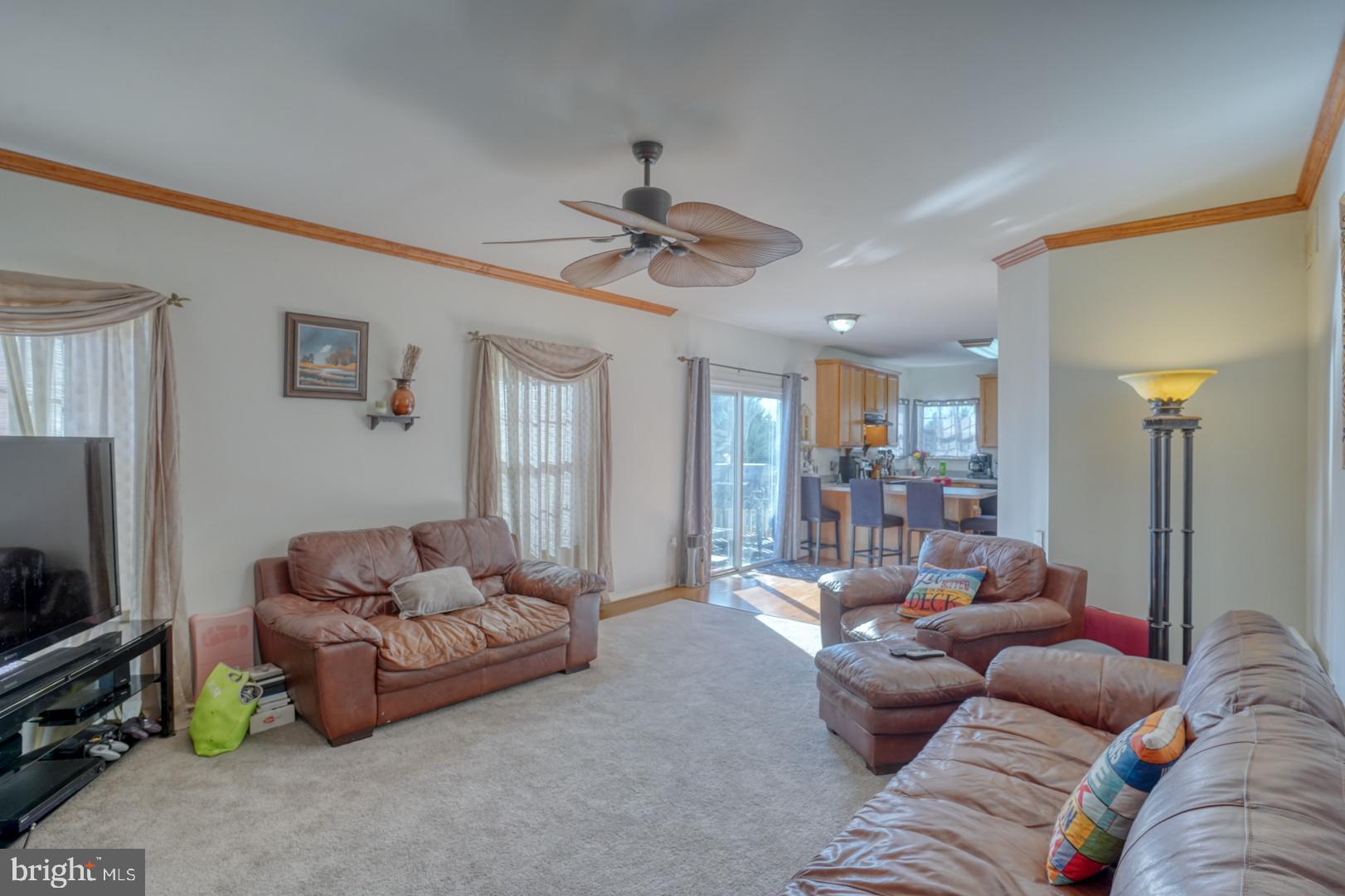 226 York Drive Smyrna, DE 19977 - Photo 19 of 60 a living room with furniture and a flat screen tv