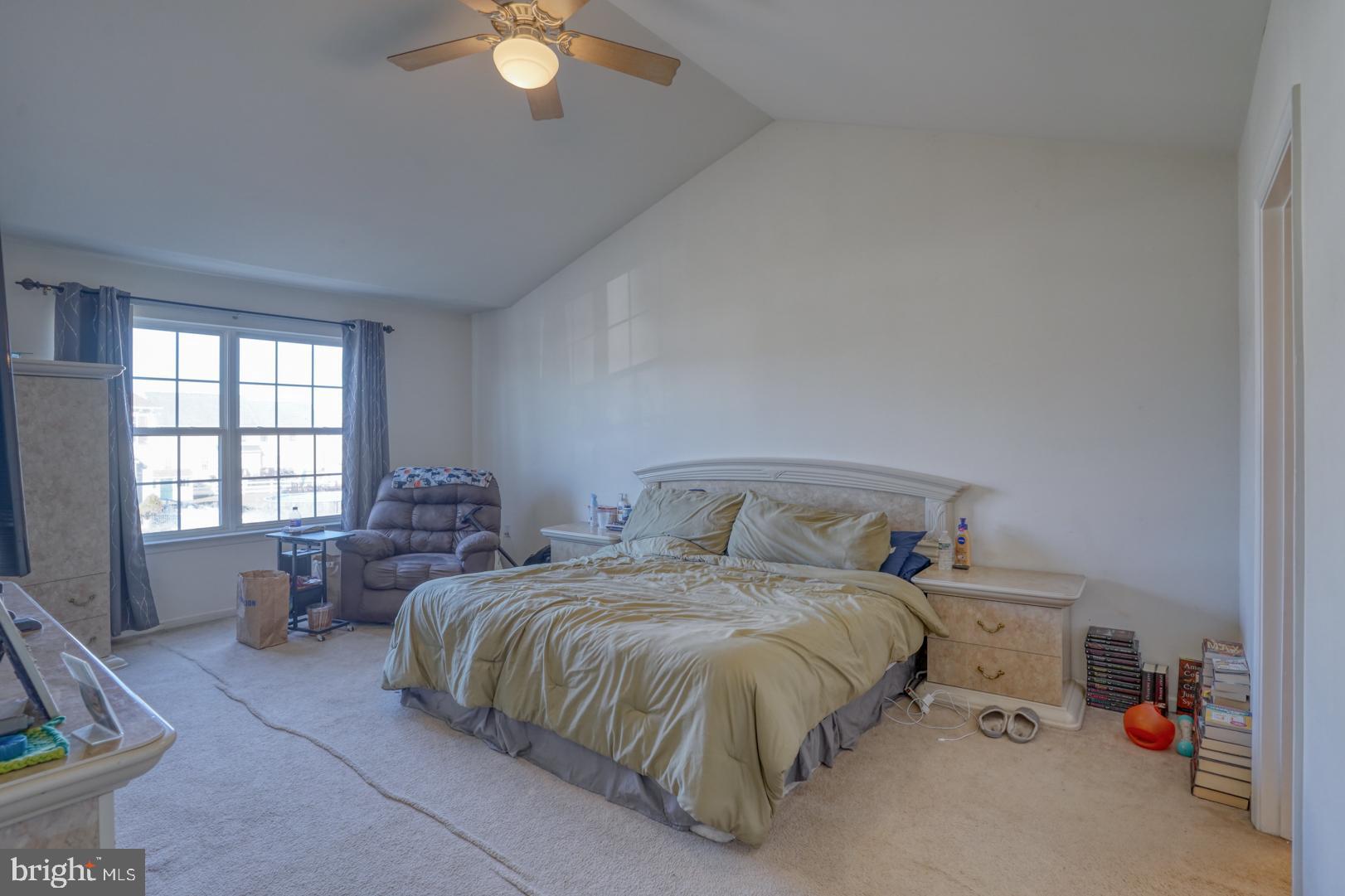 226 York Drive Smyrna, DE 19977 - Photo 20 of 60 a bedroom with a bed and a chandelier