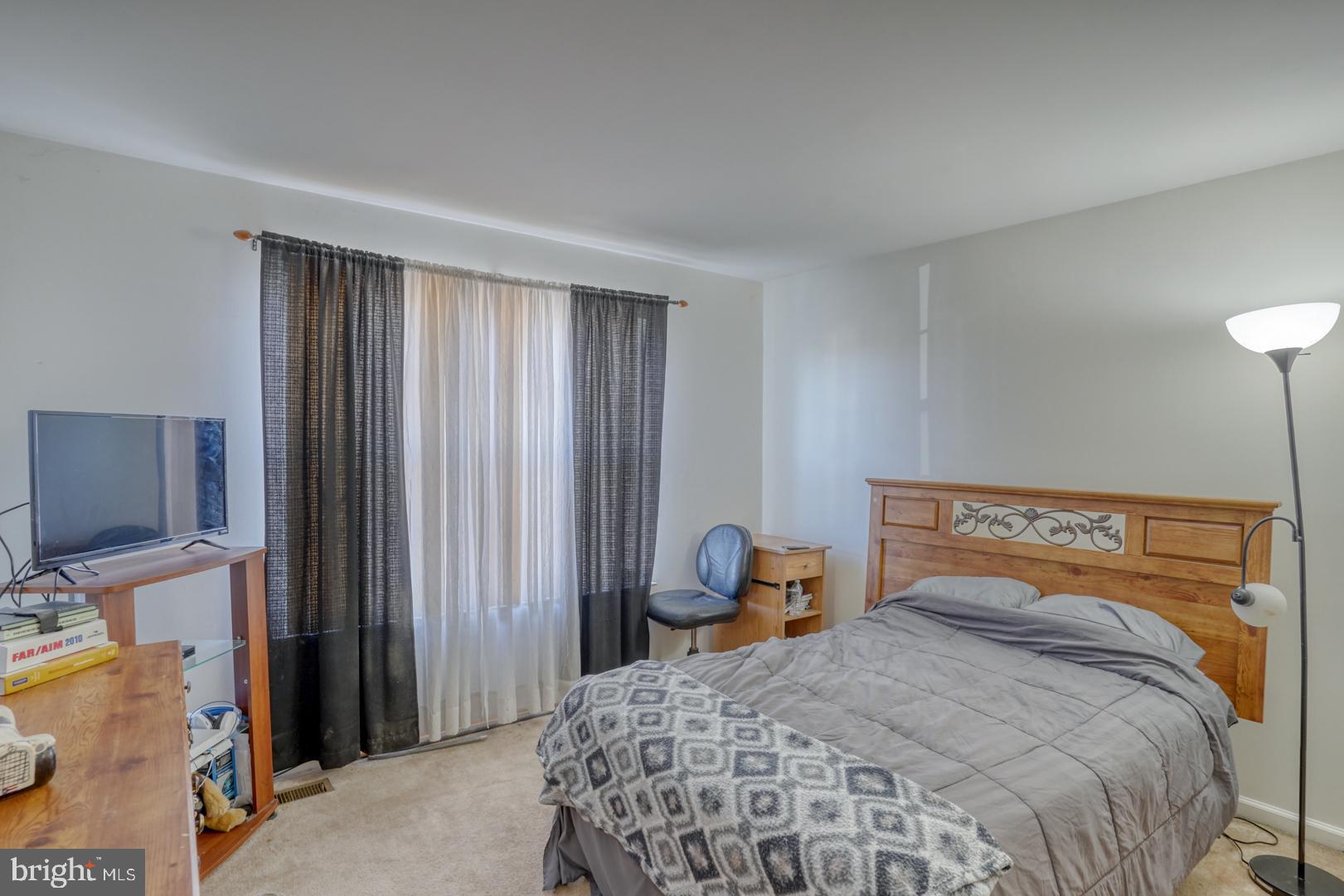 226 York Drive Smyrna, DE 19977 - Photo 24 of 60 a bedroom with a bed and wooden floor