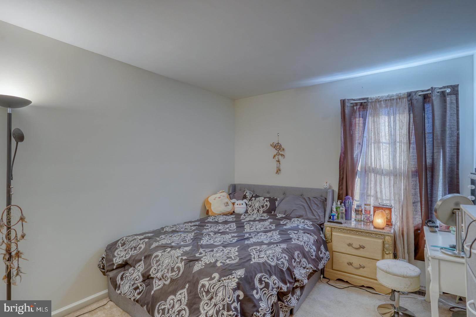 226 York Drive Smyrna, DE 19977 - Photo 27 of 60 a bedroom with a bed and wooden floor