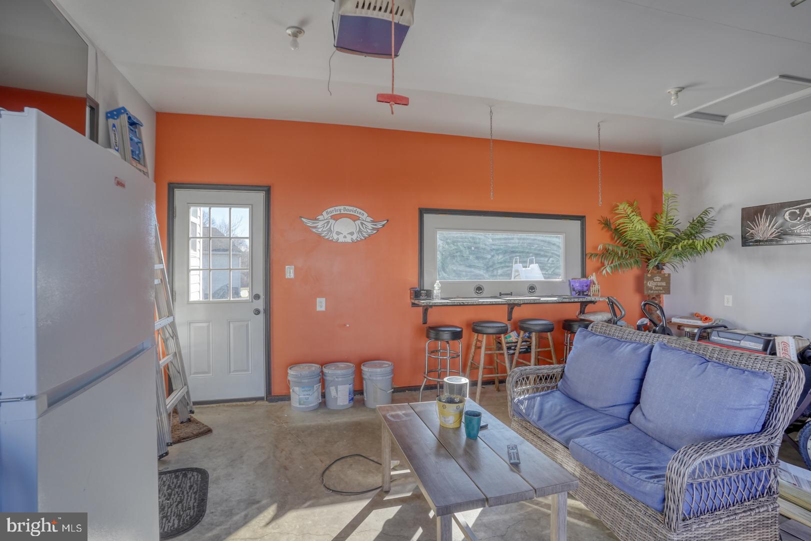 226 York Drive Smyrna, DE 19977 - Photo 40 of 60 a living room with furniture and a flat screen tv