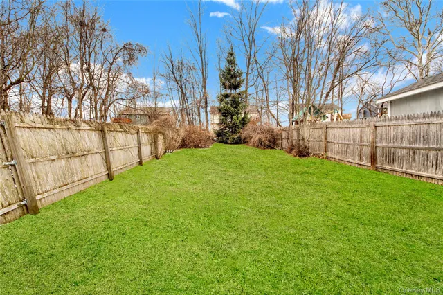 a view of a yard with a fence