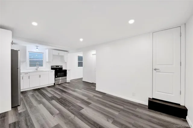 a view of kitchen with wooden floor
