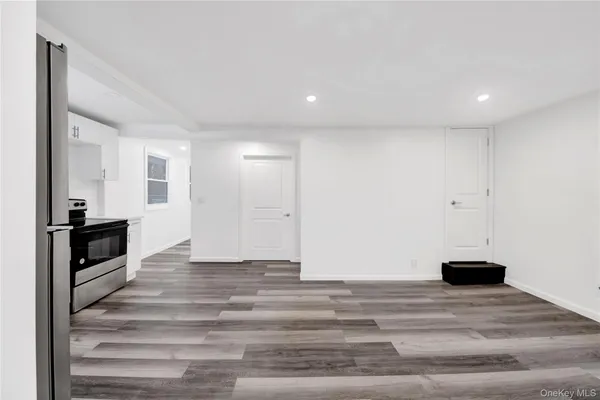 a view of a kitchen from the hallway