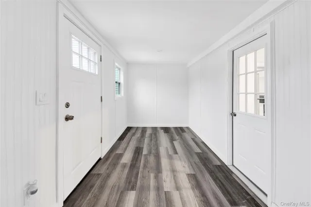 a view of wooden floor in an empty room