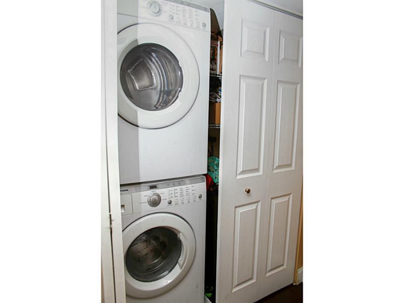 125 North Birch Road, Unit 107 Fort Lauderdale, FL 33304 - Photo 15 of 35 a utility room with dryer and washer