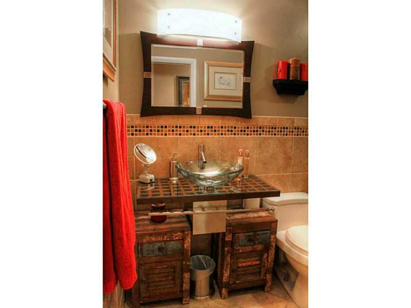125 North Birch Road, Unit 107 Fort Lauderdale, FL 33304 - Photo 22 of 35 a view of a hallway with storage and utility room