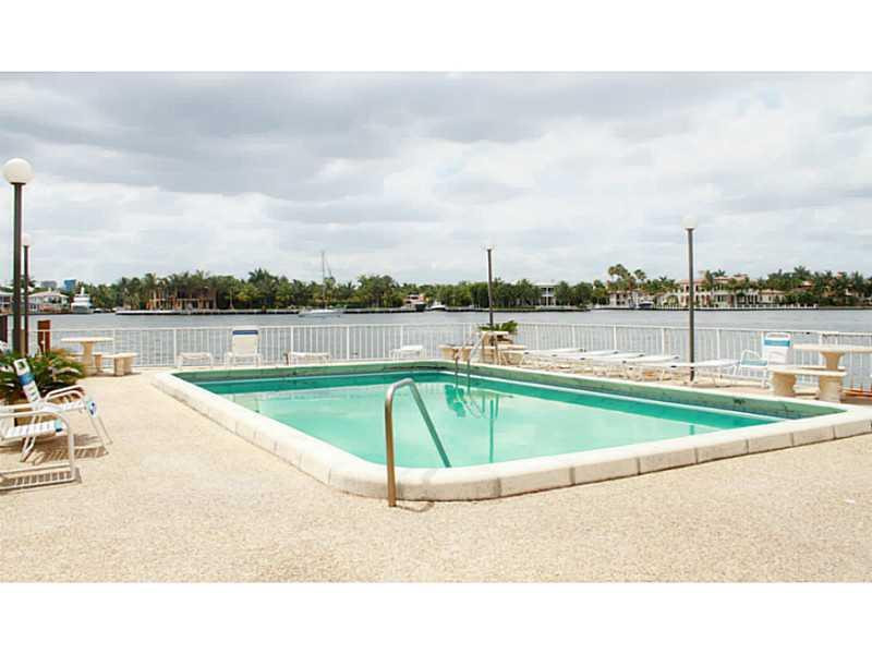 125 North Birch Road, Unit 107 Fort Lauderdale, FL 33304 - Photo 33 of 35 a view of swimming pool with outdoor seating and yard in the back