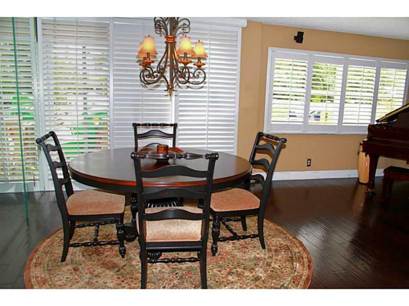 125 North Birch Road, Unit 107 Fort Lauderdale, FL 33304 - Photo 4 of 35 a dining room with furniture and window
