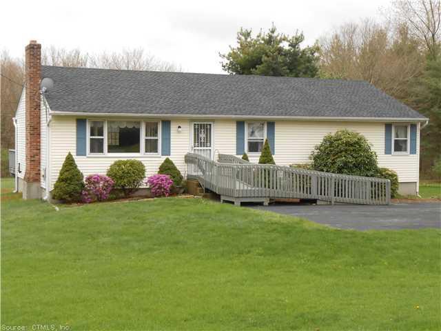1147 Exeter Road Lebanon, CT 06249 - Photo 1 of 1 a view of a house with a yard and plants